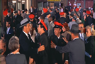 The police checking red caps at the train station (muted horns mixed in with another motif)